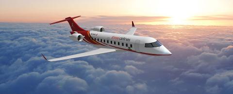 A Shree Airlines plane flies through the air above a thick layer of clouds illuminated by the setting sun.