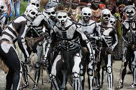 Certainly! Here's a description of the image in one sentence:A group of people in Mt. Hagen, Papua New Guinea, are adorned in intricate body paint resembling skeletons for the Mt. Hagen Cultural Show.