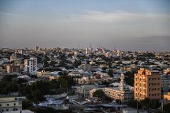 3-Day Private Mogadishu Discovery Tour (History, Culture & Coast) A sprawling cityscape with buildings of varying heights under a soft, clear sky.