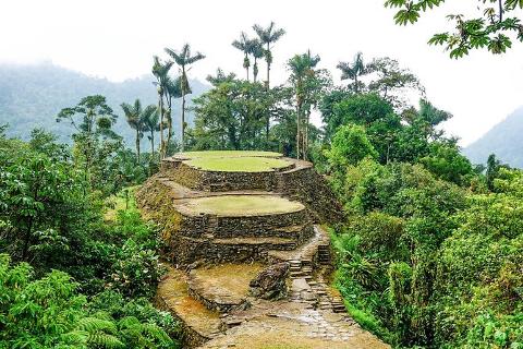 Lost City Trek Sierra Nevada Expedition (4 Days / 3 Nights) Ancient stone terraces and lush vegetation are nestled in the Colombian Sierra Nevada mountains, hinting at the Lost City expedition.