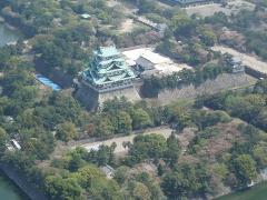 Here is an aerial view of the Nagoya Castle, a famous landmark in Nagoya, Japan, surrounded by lush greenery and a moat.