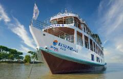 The image shows the MV Sea Pearl Cruise 3 ship, a white vessel with brown and blue accents, in calm waters with a blue sky and scattered clouds overhead.