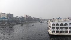 Bangladesh in 7 Days: Dhaka, Sreemongol & the Sundarbans A crowded waterway in Dhaka, Bangladesh, is bustling with boats and ships, showcasing the city's vibrant riverine life.