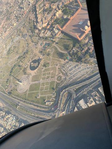 Aerial view of Lahore, Pakistan, featuring the Minar-e-Pakistan monument and the iconic Badshahi Mosque.