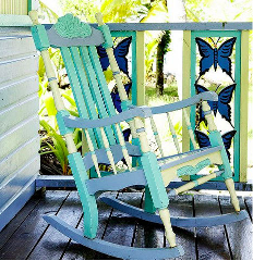 A rocking chair sits on a porch in Bocas del Toro Getaway.