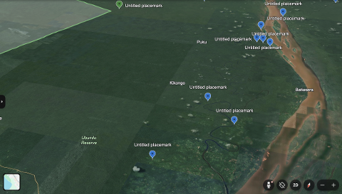 This Google Earth image shows a satellite view of the Ubundu Reserve in the Democratic Republic of Congo, featuring lush green jungle, a winding river, and multiple "Untitled placemark" pins.