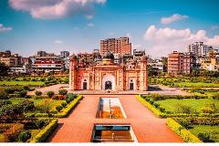 Lalbagh Fort in Dhaka, Bangladesh, with its iconic Mughal architecture and well-manicured gardens, stands as a testament to the region's rich history and cultural heritage, under a bright sky.