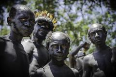 A group of painted performers from Papua New Guinea's Goroka Show Festival pose for a striking photo.