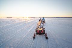 Snowmobile Daytime - 2 people driving one machine