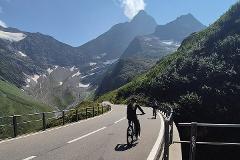 Alpine Pass Descent: Downhill Cycling Adventure in the Swiss Alps