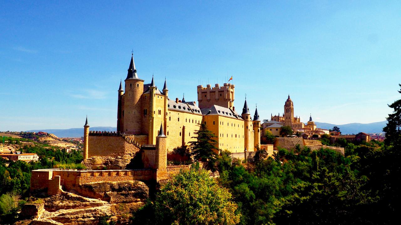 Segovia with a small group with a glass of wine in your hand