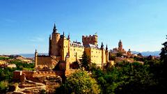 Segovia with a small group with a glass of wine in your hand *