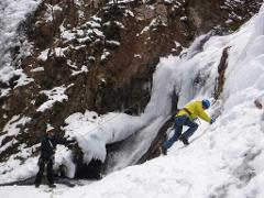Two ice climbers ascend a frozen waterfall in Nikko, Japan, a popular winter destination.