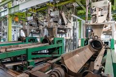 An industrial tea processing facility with large machines and conveyor belts.