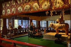 An Osuwa Daiko performance tour shows people a special temple experience with drums, chanting, and a wooden elephant statue.