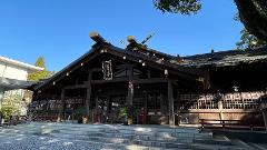 Ise/ Rental Electric Scooter~sacred river route~/90min A traditional Japanese shrine with a dark wooden exterior and ornate golden accents under a clear blue sky.