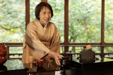 Kaga Half-Day Tour: Discover Lacquerware & Matcha Traditions A woman in a traditional kimono performs a Japanese tea ceremony, surrounded by exquisite lacquerware.