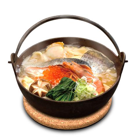 A hearty seafood "houto" noodle soup steams in a rustic iron pot, brimming with fish, shrimp, salmon roe, mushrooms, and greens.