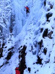 Two ice climbers ascend a frozen waterfall in Nikko, Japan, a popular winter destination near Tokyo.